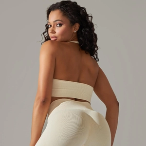 Detailed back view of beige seamless ribbed yoga set including sports bra and high waist leggings