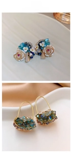 Detailed view of crystal floral stud earrings and blue gemstone cluster earrings