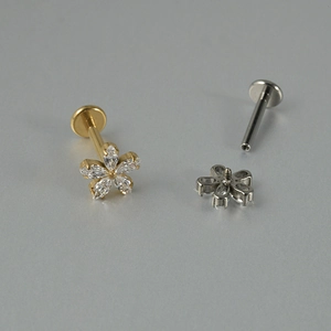 Detail of flower titanium labret stud showing internal thread and zircon petals