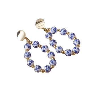 Blue and white porcelain beaded hoop earrings with gold accents for women