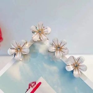 Set of 4 white camellia flower hair clips with sparkling center rhinestones