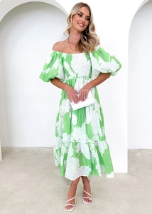 Detail of off-shoulder puff sleeves and floral print on an elegant summer dress