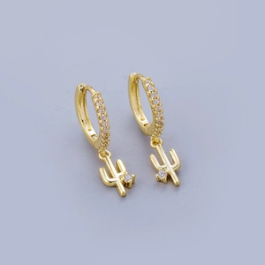 Detail of gold hoop earrings with white zircon crystals and cactus pendant charms