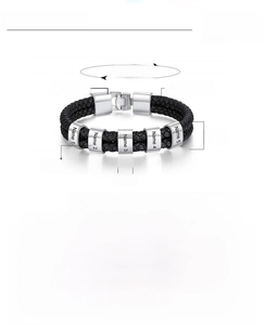 Macro detail of men's double-layer braided leather bracelet with engravable steel charms