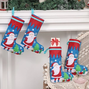 Blue and red Christmas stockings with Santa embroidery hanging on a fireplace mantel