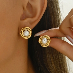Detail view of French vintage gold spiral pearl earrings for elegant women's jewelry set