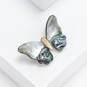 Elegant natural shell butterfly brooch with black, abalone, and yellow shell inlay