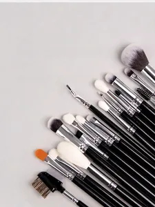Detailed close-up of a 40-piece makeup brush set with black handles and silver ferrules
