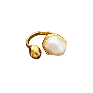 Gold plated oval pearl open ring featuring a minimalist irregular white resin stone design