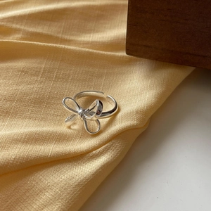 Macro shot of S925 sterling silver hallmark on the adjustable bow ring inner band