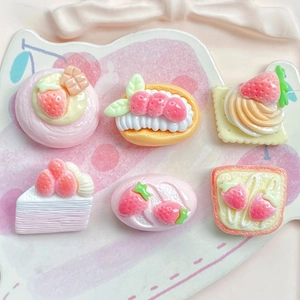 Detail view of 6-piece resin strawberry cake charms for DIY crafts and accessories