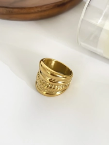 Detail of 18K gold plated multi-layer ring featuring textured rope design and smooth bands