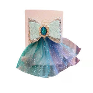 Mint green sequined snowflake bow hair clip with mesh ribbon for girls on white background