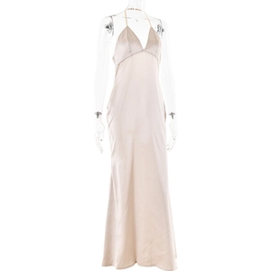 Detail of elegant beige silk V-neck maxi dress with delicate spaghetti straps