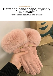 Pink suede winter gloves with elegant faux fur cuffs and a decorative metal logo plate