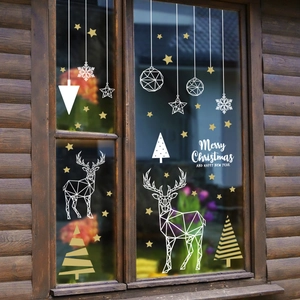 Christmas window stickers with geometric deer, stars and snowflakes on glass window