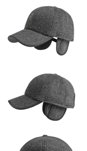 Detail view of winter baseball cap with ear flaps in grey herringbone fabric and leather patch