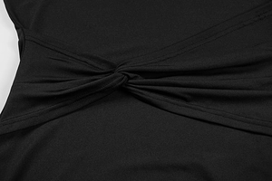 Close-up of twisted knot detail and ruched texture on black bodycon dress fabric