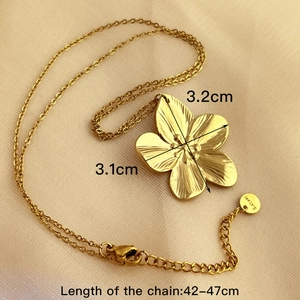 Elegant gold-plated stainless steel floral pendant necklace with sunburst texture