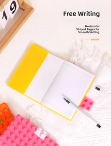Detail of A6 yellow silicone notebook with lined inner pages on soft fabric