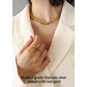Minimalist knotted titanium steel ring and U-link chain necklace set in 18k gold finish