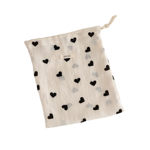 Champagne heart drawstring pouch in beige fabric for jewelry and small item storage