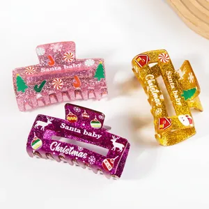 Three-piece Christmas acrylic hair claw clips with Santa Baby and festive glitter patterns