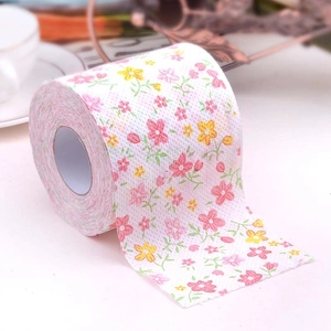 Premium toilet paper roll with pink and yellow floral print and soft embossed texture