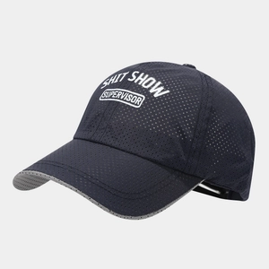 Detail of dark blue mesh baseball cap with white SHIT SHOW SUPERVISOR slogan text