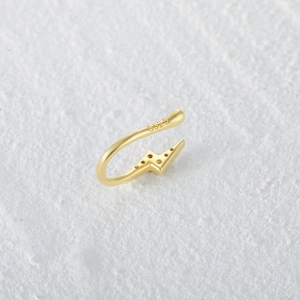 Detailed close-up of 925 sterling silver S925 hallmark on a golden lightning nose cuff