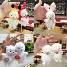 Detailed view of plush lamb keychains with colorful animal hoods and floral decorations