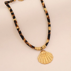Detail of leopard print fabric cord necklace with a golden shell pendant and extension chain