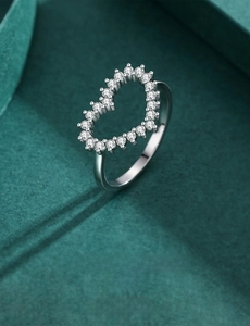 Macro view of S925 sterling silver hollow heart ring with micro-pave cubic zirconia