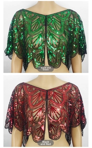 Detail of sheer mesh cape with shimmering sequins and retro scalloped hemline