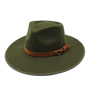 Close-up of dark green wool felt fedora hat featuring a brown leather band and gold ring