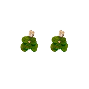 Retro green acrylic flower earrings with gold petals and marble texture on white background