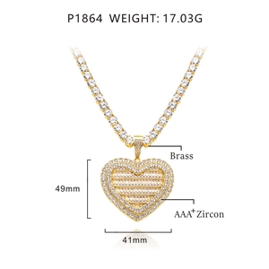 Detailed view of large iced-out heart pendant with dimensions and brass material specs