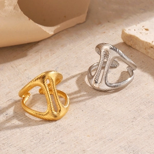 Abstract geometric stainless steel open rings in gold and silver with textured surface