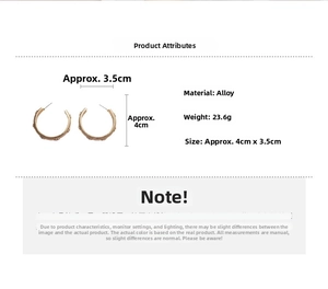 Detailed view of gold C-shape hoop earrings with textured bead pattern and 4cm dimensions