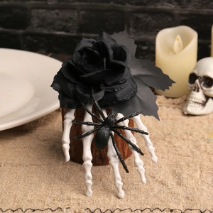 Halloween black rose hair clip with skeleton hand and spider on a rustic background