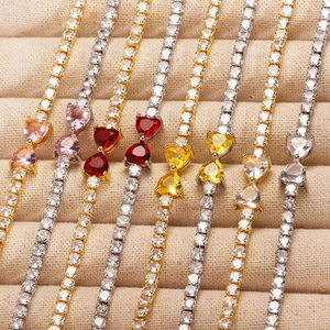 Detailed view of colorful zircon heart tennis bracelets in gold and silver plating