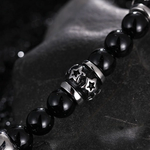 Men's beaded necklace with black obsidian stones and silver star engraved metal charms