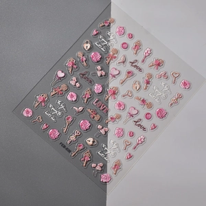 Detailed macro view of 3D embossed nail stickers with pink roses and love key designs