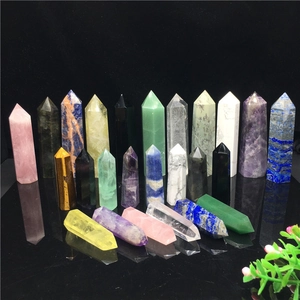 Macro shot of assorted natural crystal towers including amethyst and rose quartz on black