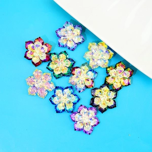Close-up of vibrant crystal flower pins with multi-faceted petals and AB rainbow coating