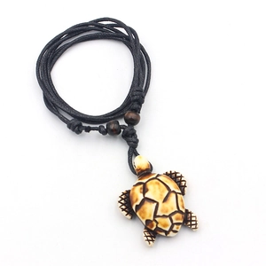 Ethnic sea turtle pendant necklace with beige resin shell and brown wooden beads