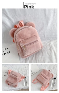 Detail of pink plush backpack featuring fuzzy bear ears and adjustable fabric shoulder straps
