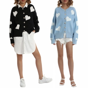 Close-up of contrast heart pattern and large buttons on knit cardigan jackets