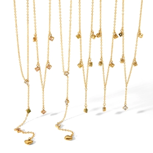 Detail of 18k gold plated Y-shaped necklaces with zircon stones and heart pendants