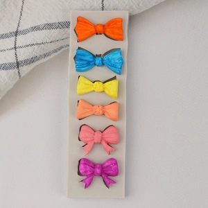 Multi-slot bow shaped silicone mold for chocolate baking and fondant cake decoration